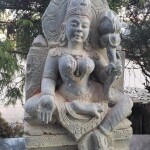 STONE SCULPTURE LADY WITH LOTOS